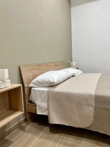 Postel nebo postele na pokoji v ubytování Antico Borgo Rooms
