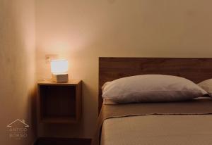 Postel nebo postele na pokoji v ubytování Antico Borgo Rooms