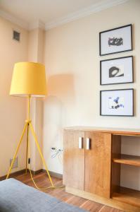 a yellow lamp in a room with a table at Himmel Blau Rentals in Río Grande