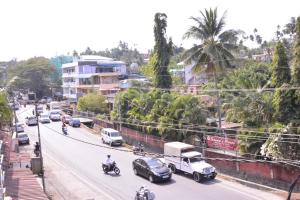 a busy city street with cars and motorcycles at SEA SUN PARADISE in Port Blair
