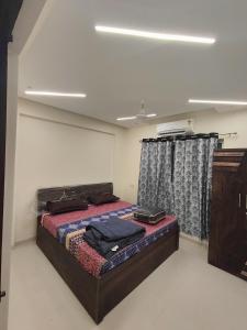 Ein Bett oder Betten in einem Zimmer der Unterkunft Gandhi Villa