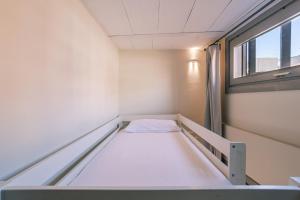 Letto o letti in una camera di Apt 1 Ylang