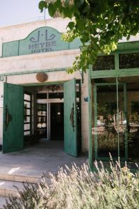 an entrance to a store with a green door at Heybe Hotel & Spa in Goreme