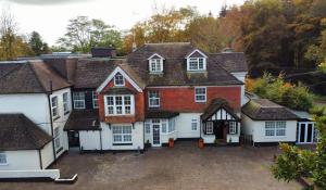 an aerial view of a house with a driveway at Royal Swan, Ashley Manor - Bed and Breakfast in Shedfield