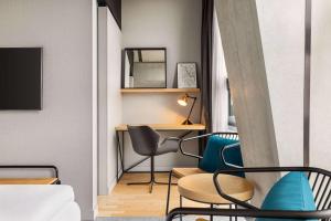 Cama ou camas em um quarto em Vienna House by Wyndham Mokotow Warsaw