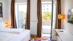Postel nebo postele na pokoji v ubytování A Hotels Glostrup + 37 fotografií