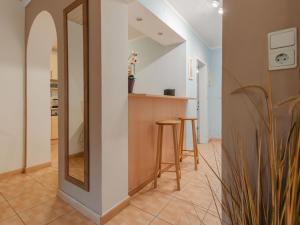a hallway with a mirror and a bar in a house at Apartment Terrace Garden Retreat by Interhome in Badbruck +22 photos
