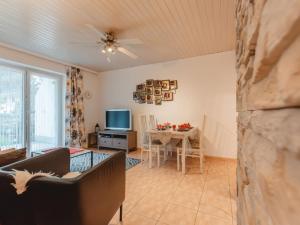 a living room with a couch and a table at Apartment Terrace Garden Retreat by Interhome in Badbruck