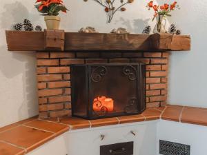 a fireplace with a pumpkin on top of it at Apartment The Alpine Classic by Interhome in Badbruck