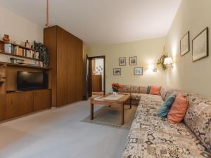a living room with a couch and a coffee table at Apartment Sun & Mountain View by Interhome in Bad Hofgastein
