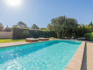 a swimming pool in the backyard of a house at Holiday Home Le Mas des Buis by Interhome in Uchaux