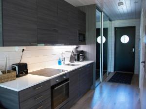 a kitchen with a sink and a counter top at Holiday Home Kasnäs marina c 22 by Interhome in Kasnäs