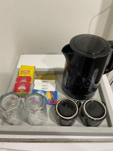 eine Kaffeekanne auf einem Regal in einem Kühlschrank in der Unterkunft French 2-bed in Rawalpindi