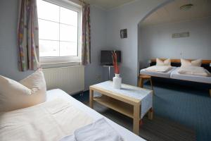 Postel nebo postele na pokoji v ubytování Hotel Dolgesheim + 19 fotografií