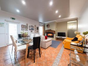 sala de estar con muebles y chimenea en Holiday Home D'Olivia - NZE220 by Interhome en Cela