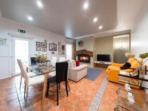 sala de estar con muebles y chimenea en Holiday Home D'Olivia - NZE220 by Interhome, en Cela