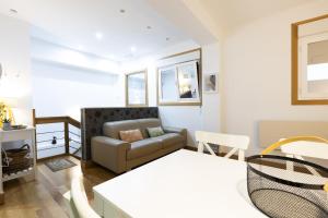 a living room with a couch and a table at ARROLA by Smiling Rentals in Hondarribia