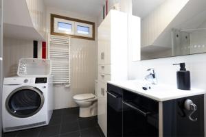 a bathroom with a washing machine and a sink at ARROLA by Smiling Rentals in Hondarribia +38 photos