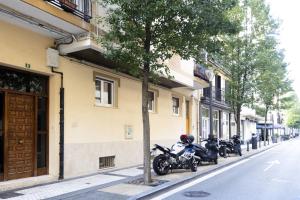 a group of motorcycles parked next to a building at ARROLA by Smiling Rentals in Hondarribia