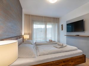 Postel nebo postele na pokoji v ubytování Apartment Burgblick alpe maritima Ski & See-Top 26 by Interhome