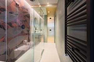 a bathroom with a shower and a sink at Dimora San Girolamo Luxury Apartments e Rooms in Marsala +30 photos
