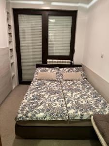 Postel nebo postele na pokoji v ubytování Apartment Sweet Dreams-close to ZOO,Dinamo stadium and the city center