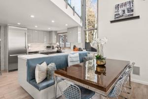 a kitchen with a blue couch and a table at Snowmass Villas 3 plus loft in Snowmass Village