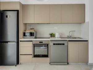 Virtuvė arba virtuvėlė apgyvendinimo įstaigoje Sanders Evolution 2 Limassol