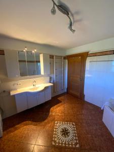 a bathroom with a sink and a mirror at Bauniglerhof in Riedering