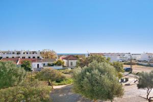a view of a town with trees and buildings at Tavira Mar in Cabanas de Tavira
