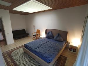 a bedroom with a bed and a skylight at Balingen Apartment in Balingen