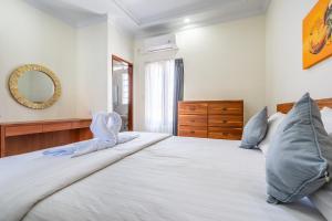 Кровать или кровати в номере Rava Villa Andong