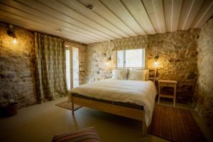 a bedroom with a large bed in a room at Pilguse Residency in Jõgela