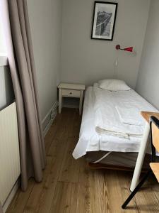 Katil atau katil-katil dalam bilik di Halmstad Hotell & Vandrarhem Kaptenshamn