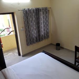 Ένα ή περισσότερα κρεβάτια σε δωμάτιο στο Ever green guest house