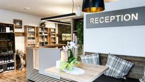 a store with a vase of flowers on a table at City Zimmer - Appartement Dina Mariner in Lienz