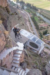 a group of people walking down stairs on a mountain at Starlodge Adventure Suites in Urubamba