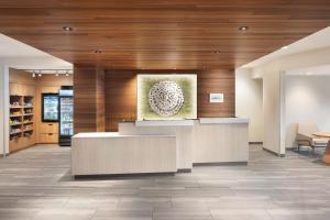a lobby with a reception desk in a building at Fairfield Inn & Suites by Marriott West Kelowna in West Kelowna +27 photos