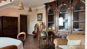 a dining room with a table and some chairs at Villa Felici in Giuliano di Roma