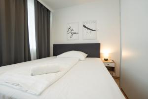 Posteľ alebo postele v izbe v ubytovaní Charming Apartment with Balcony, Close to Stephansdom Cathedral