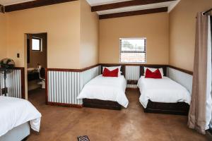 Postel nebo postele na pokoji v ubytování Rockdell Lodge