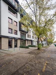 an empty street in front of a building at Premier Pest Side Apartment in Budapest