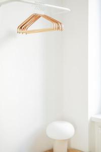 a white room with a white lamp and a shelf at City Chic #18 in Vienna