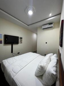 Fragrance Apartments and Suites客房内的一张或多张床位