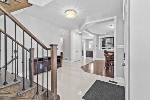 an open hallway with a staircase in a home at Ski getaway - 10 min to Snow Valley/ BBQ/ Backyard in Barrie