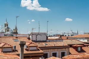 a view of roofs of buildings in a city at Charming La Latina Home in Madrid