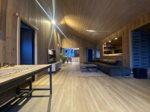 a living room with a couch and a table at Newly renovated apartment with a central location in Geilo