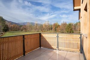 a balcony with a view of the mountains at Moosaik Appartements in Strobl