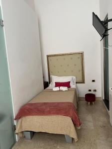 Postel nebo postele na pokoji v ubytování Hotel Valentino