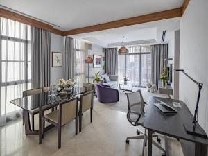 a living room with a dining table and a living room at Fraser Place Robertson Walk Singapore in Singapore